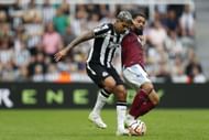 Douglas Luiz (right) has turned heads at Anfield.